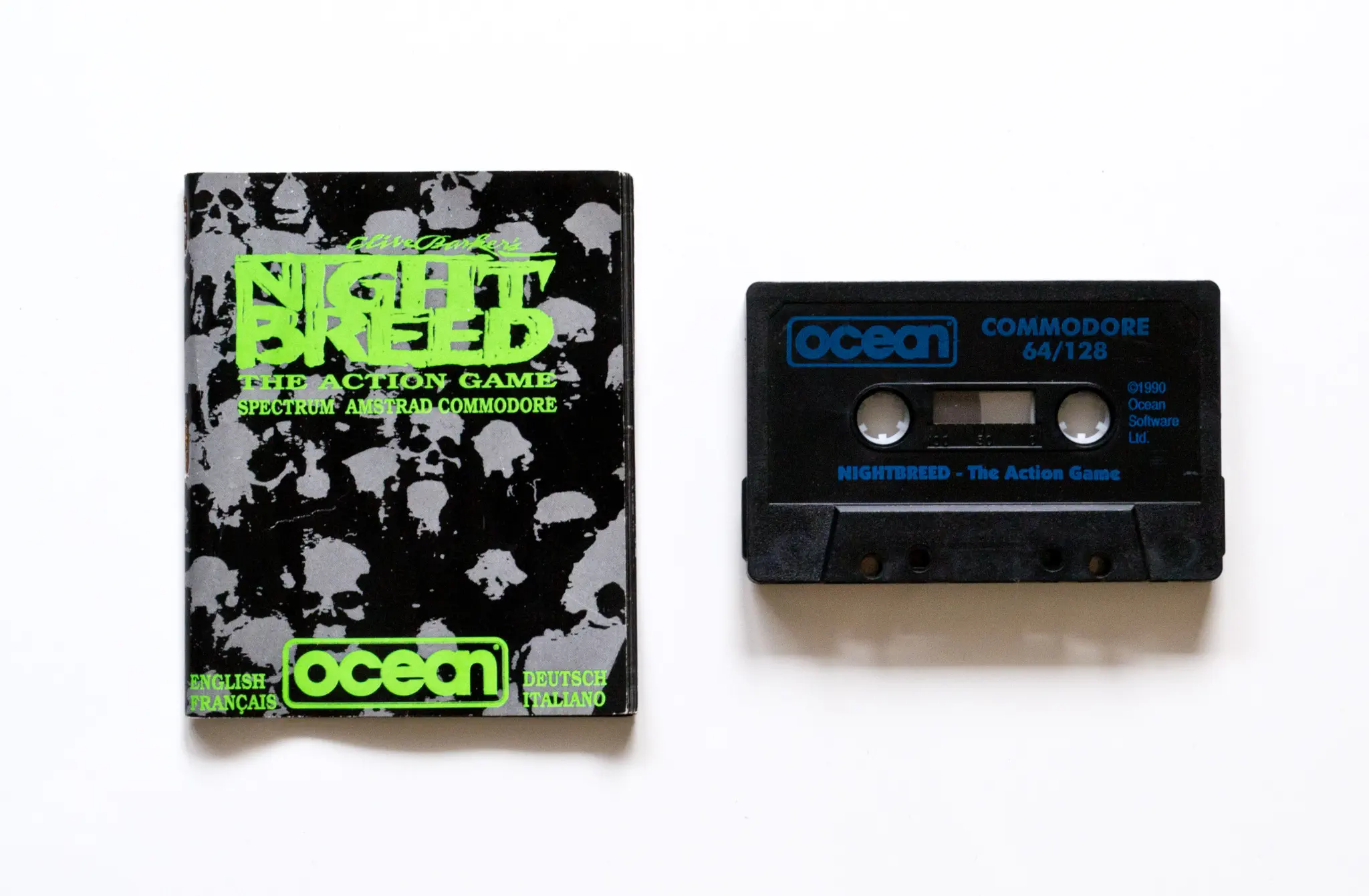 Photo of the content of Clive Barker's Nightbreed (1990, C64, EU); developed by Impact Software Development, Ltd., published by Ocean Software Ltd.; Hi-res 3D box available at https://bigboxcollection.com