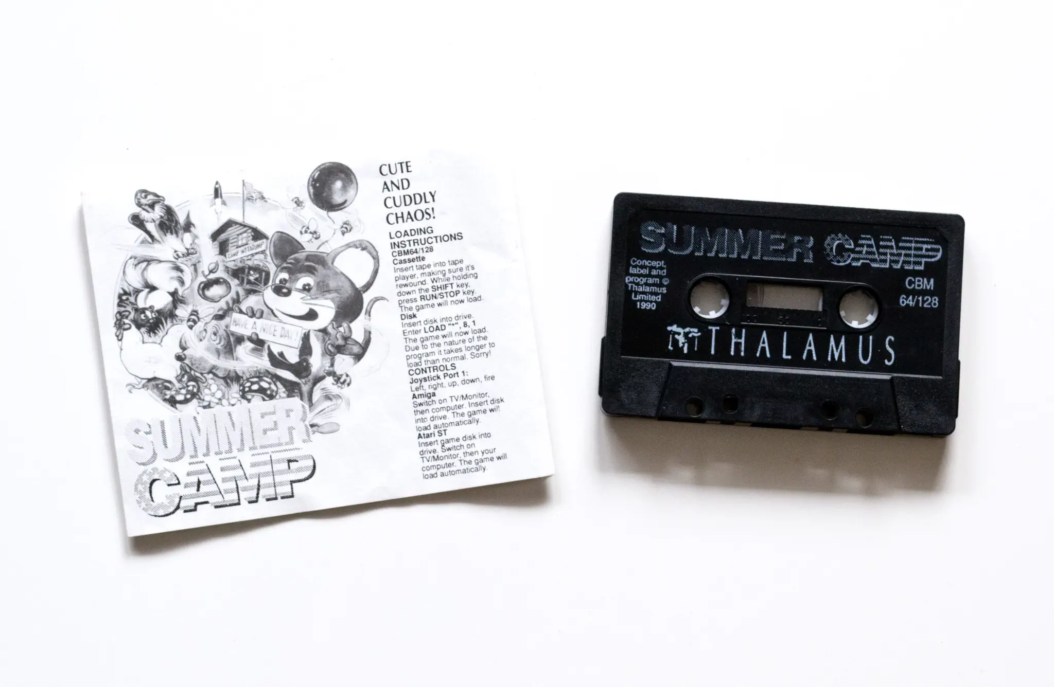 Photo of the content of Summer Camp (1990, C64, EU); developed by John D. Ferrari, published by Thalamus Ltd; Hi-res 3D box available at https://bigboxcollection.com