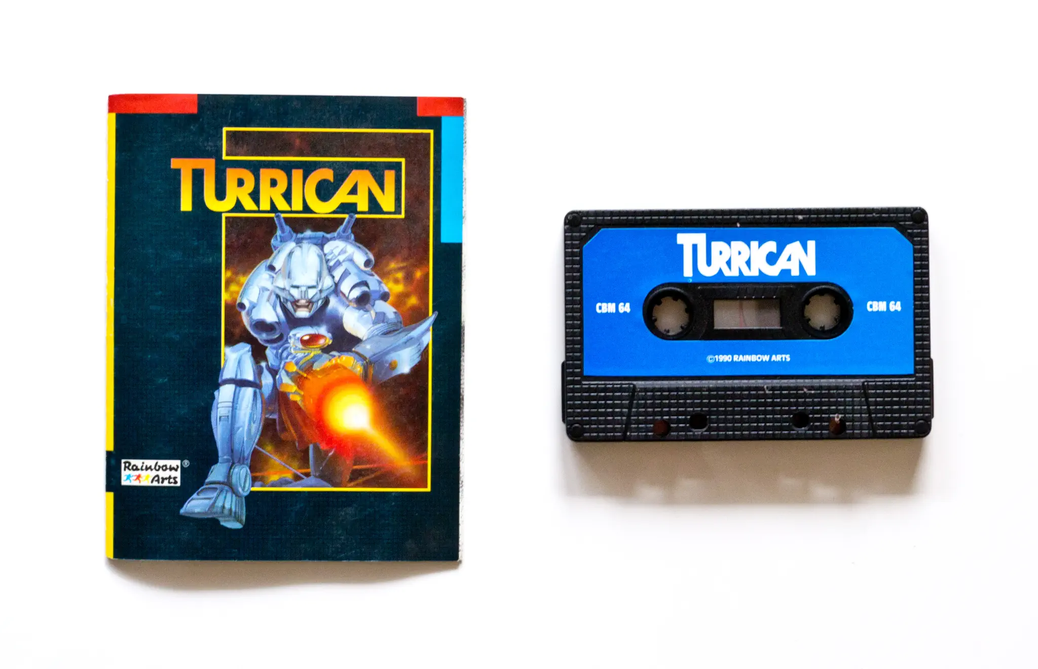 Photo of the content of Turrican (1990, C64, EU); developed by Rainbow Arts Software GmbH, published by Rainbow Arts Software GmbH; Hi-res 3D box available at https://bigboxcollection.com